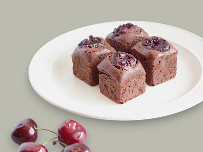 CACAOKOBO TRIBUTE カカオ工房トリビュート cherry brownies topped with fresh cherries on a white plate