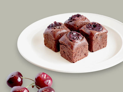 CACAOKOBO TRIBUTE カカオ工房トリビュート cherry brownies topped with fresh cherries on a white plate
