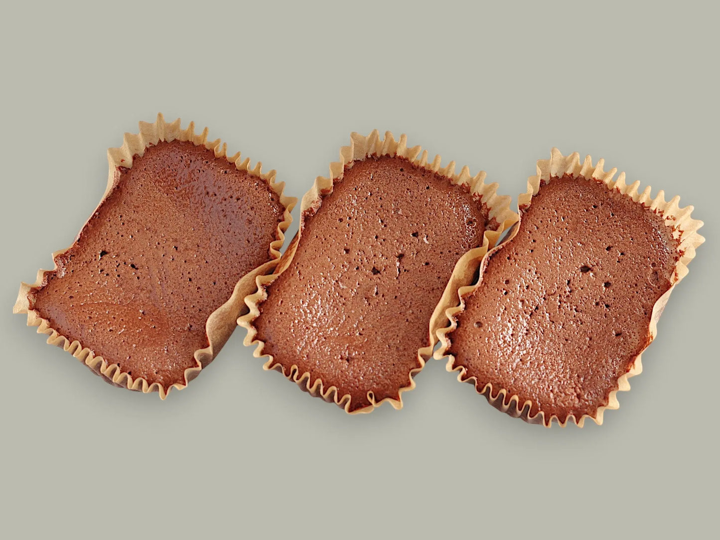 Three CACAOKOBO TRIBUTE カカオ工房トリビュート gluten-free rare chocolate cakes in individual paper liners