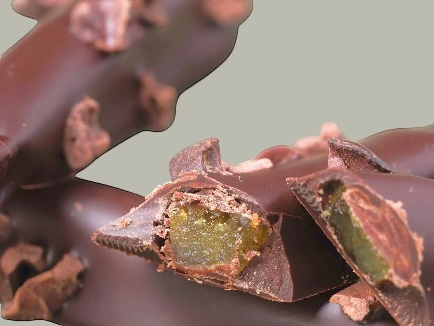 CACAOKOBO TRIBUTE ORANGETTE: dark-chocolate-covered candied orange peel with cacao nibs.